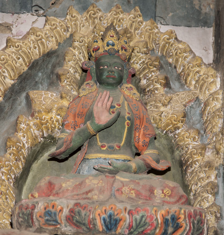 Amoghasiddha, one of the Dhyani (Supreme) Buddhas, rare Indo-Tibetan clay sculpture, main altar Senge Lhakhang, Lamayuru Monastery, Ladakh