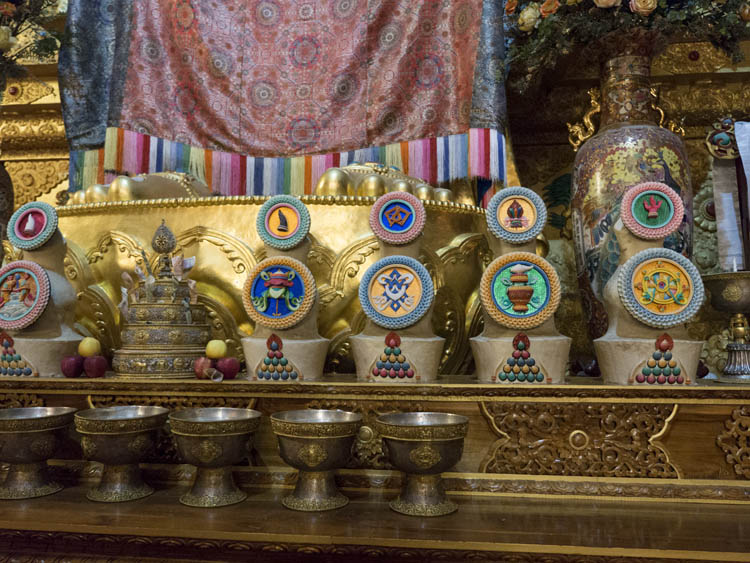 Detail of some of the Eight Auspicious Symbols of Buddhism, and other ritual objects, altar of Sherabling Monastery Main Temple