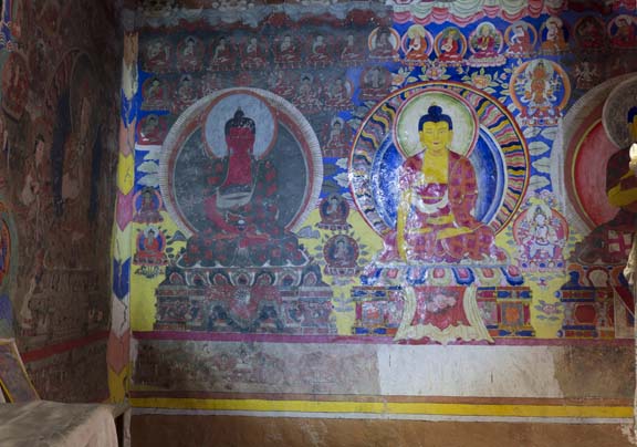 Buddha murals showing evidence of repainting over the centuries, Lhakang Gongma, Dharkar Monastery