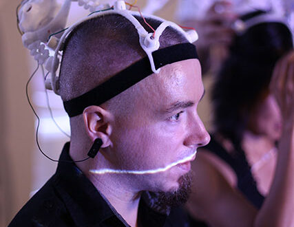 Aaron Trocola wearing his Dual Brains custom designed EEG headgear.